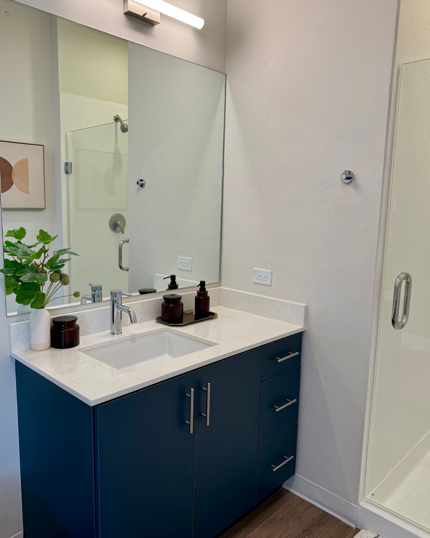Our bathrooms are designed with a clean, modern feel that makes everyday routines feel a little more elevated. \ud83e\udee7 \ud83d\udec1\n\nStand-up showers with sleek glass doors bring a spa-like touch right into your home with generous countertop space gives you room to spread out and keep everything organized with ease. The thoughful finishes and bright lighting create a fresh, open atmosphere you'll appreciate every day.\n\nIt's a space built for comfort, convenience, and a simple sense of calm.