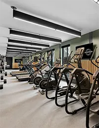 24 Hour fitness center with treadmills, ellipticals, and strength training