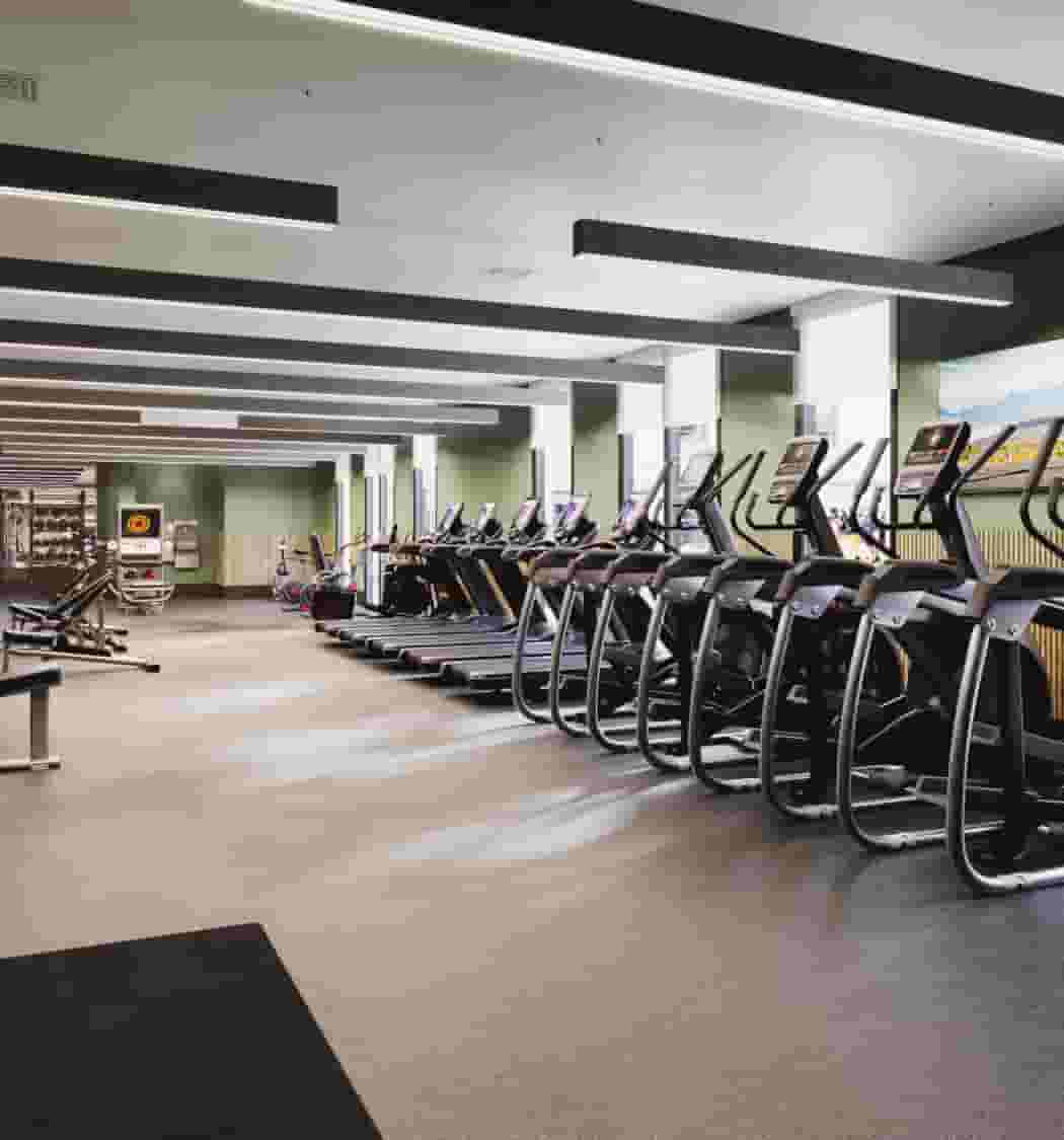24 Hour fitness center with treadmills, ellipticals, and strength training